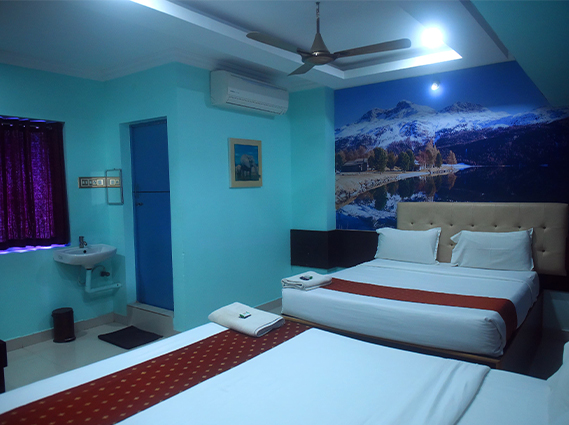 Modern hotel bathroom with premium fittings and hygienic interiors at a hotel near Rockfort temple TrichyLarge family accommodation with two double beds and premium comfort, offering AC family rooms in Trichy