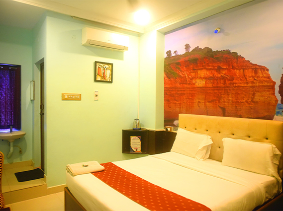 Standard Double Room with modern amenities and premium bedding at a hotel near Trichy bus stand