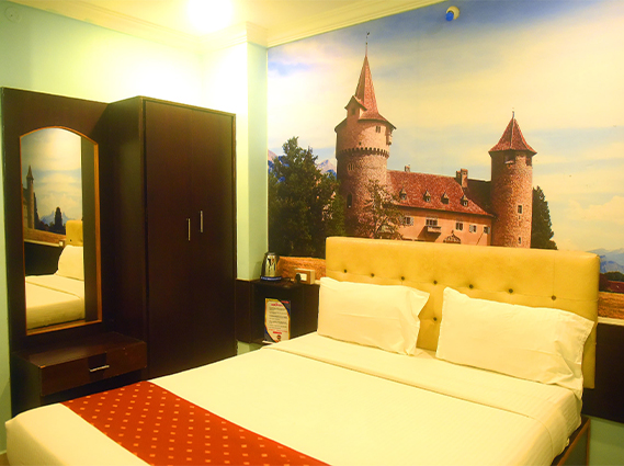 Deluxe double room with premium bedding and modern amenities at a family hotel in Trichy