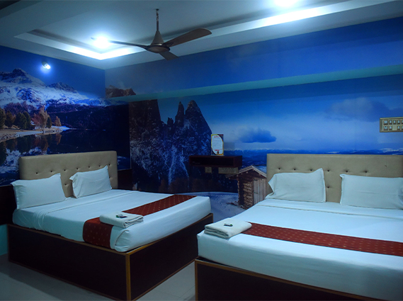 Twin-bed AC room with premium bedding, ideal for a comfortable budget stay in Trichy.