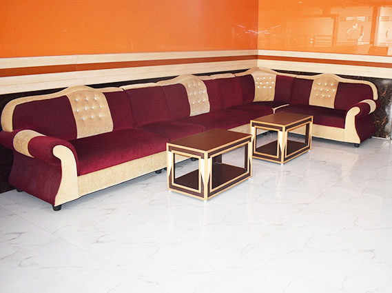 Spacious guest lounge with comfortable seating at a family hotel in Trichy.