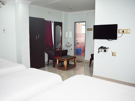 Twin Room with two comfortable beds and modern amenities for a relaxing budget stay in Trichy.